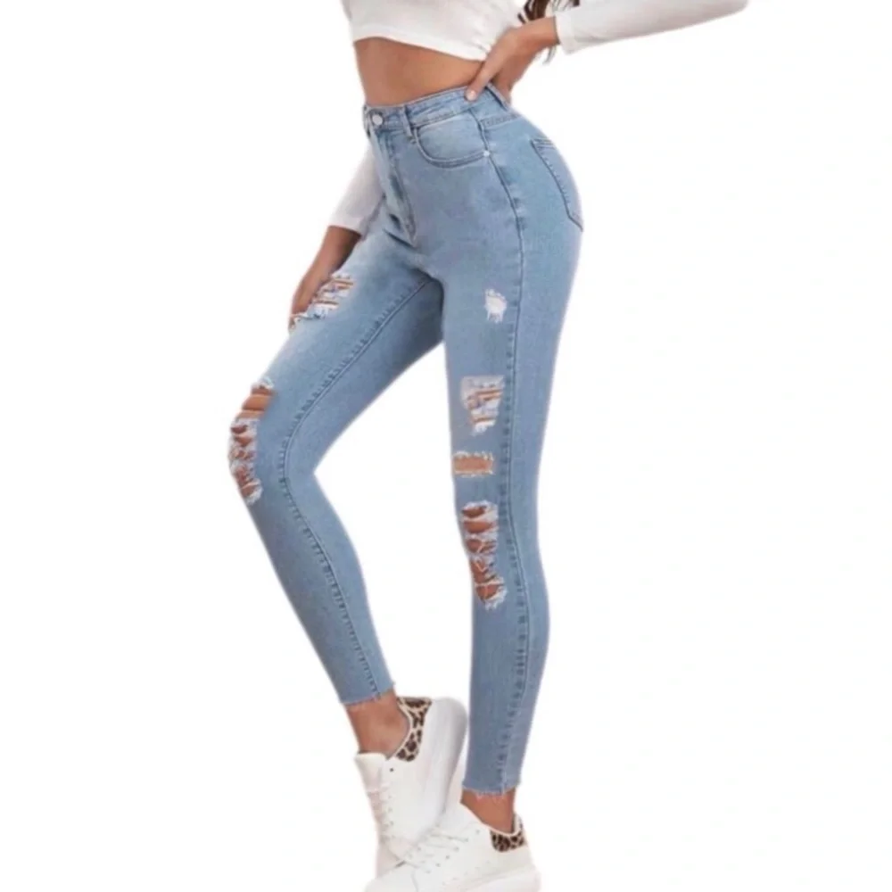 High Waisted Ripped Raw Hem Light Wash Skinny Jeans